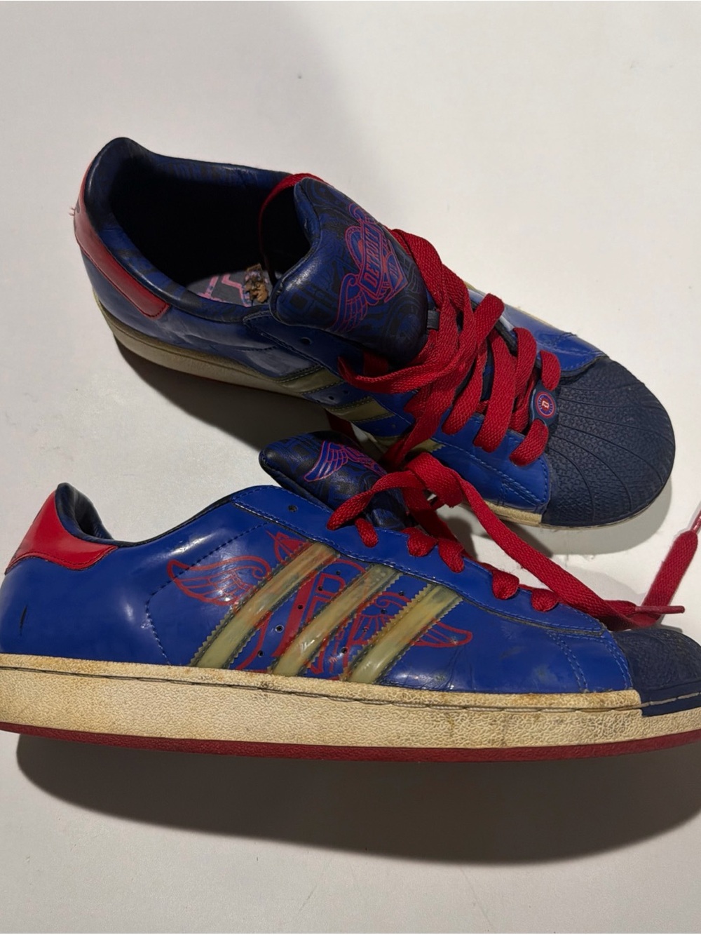 adidas Blue Sneakers with Red Laces and Gold Stripes